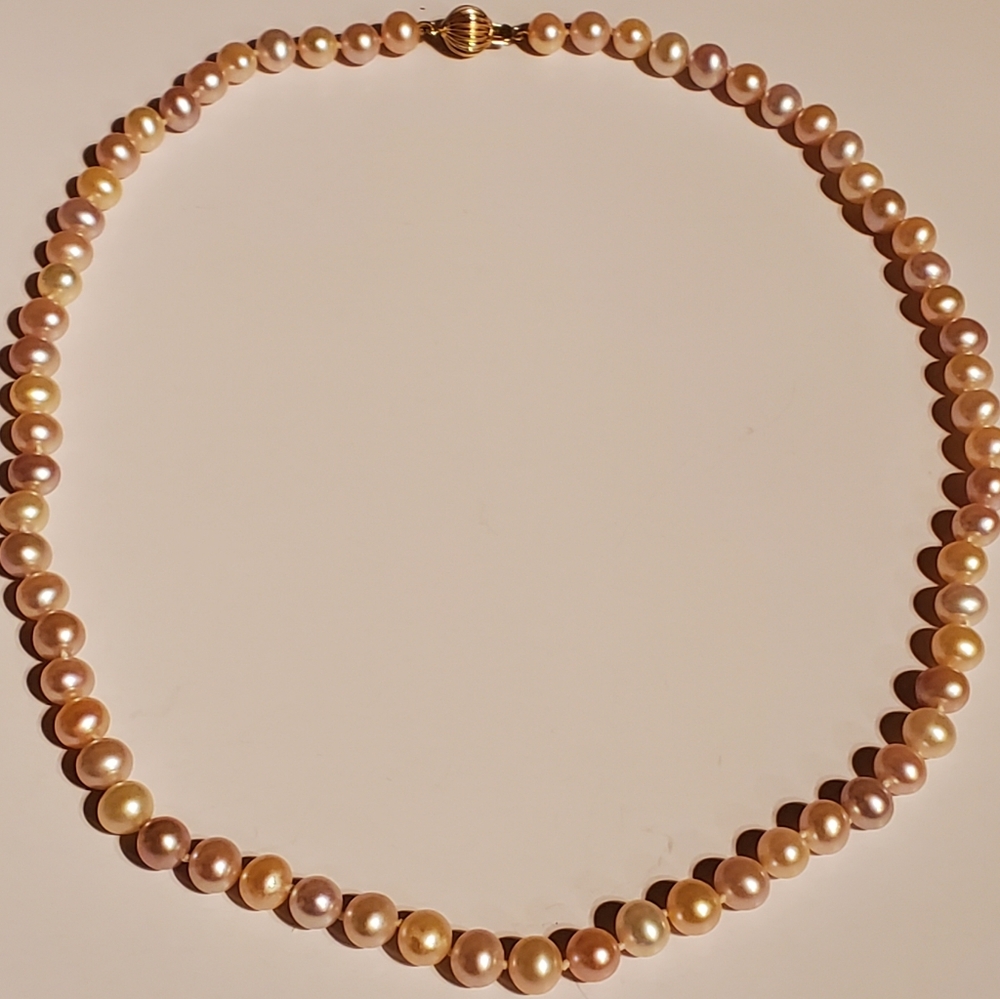 Strand of cultured pearls with multi colors of pink hues